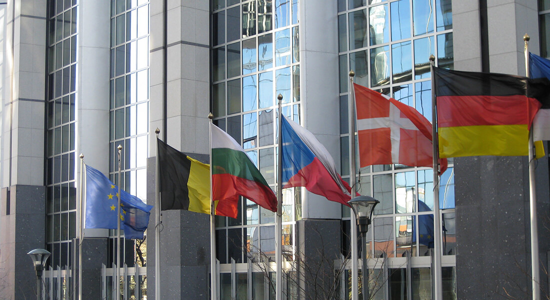 Flag in front of the European Parliament. Photo: TPCOM / Flickr (CC 2.0)